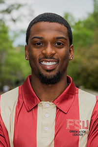 smiling male student with close-cropped brown hair