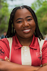 smiling female student with long braids