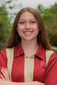smiling female student with long red hair