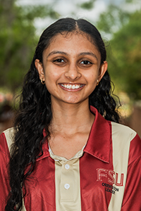 smiling female student with long brown hair
