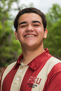 smiling male student with short brown hair and brown eyes